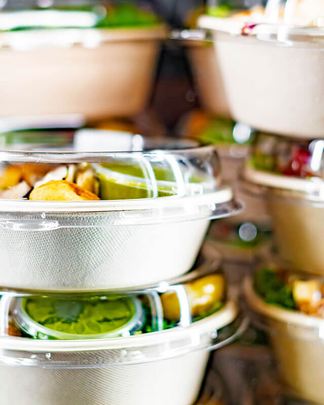 Prepared meals in containers stacked