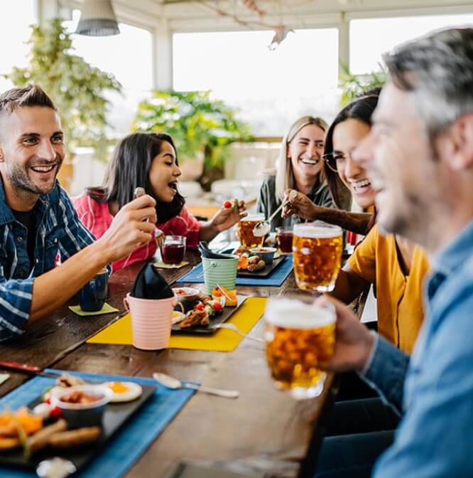 Friends eating and laughing together